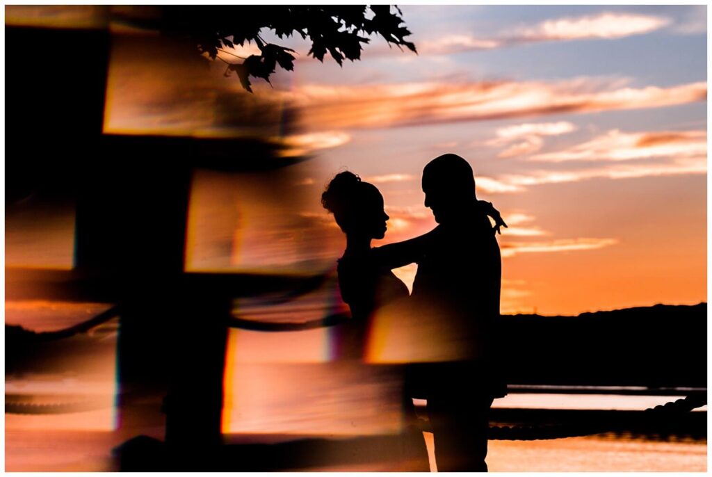 bride and groom at sunset during ohio wedding photography by the water