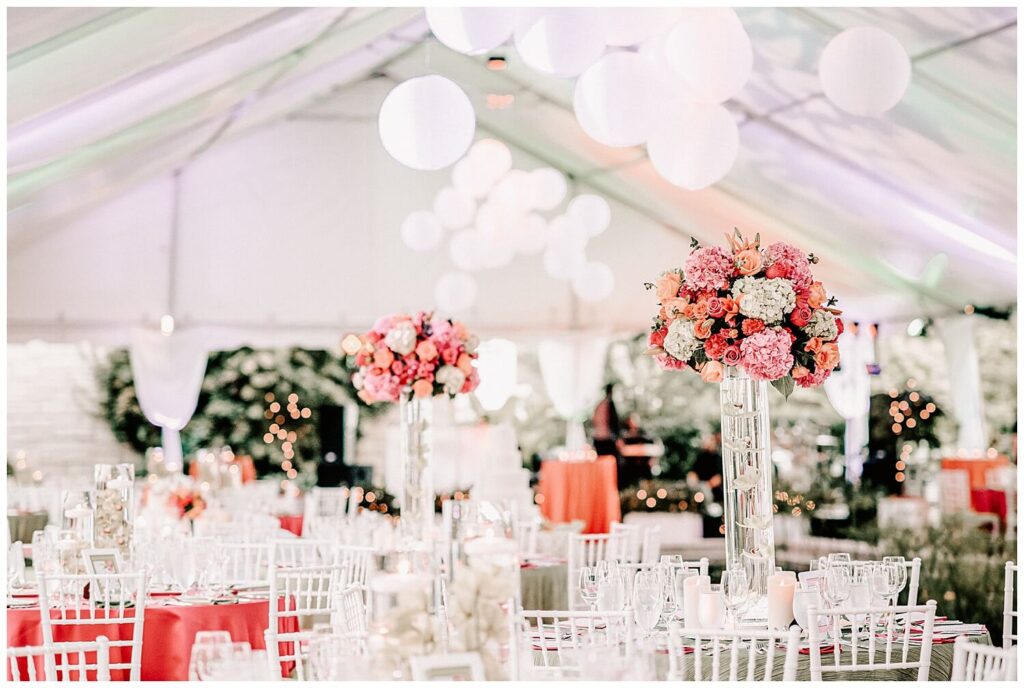 bright colorful wedding reception decorations and centerpieces in tent at cleveland garden wedding