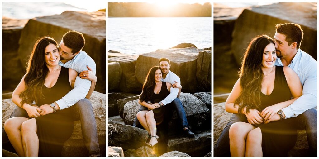 bride and groom sitting on rocks at edgewater beach ohio for engagement photos