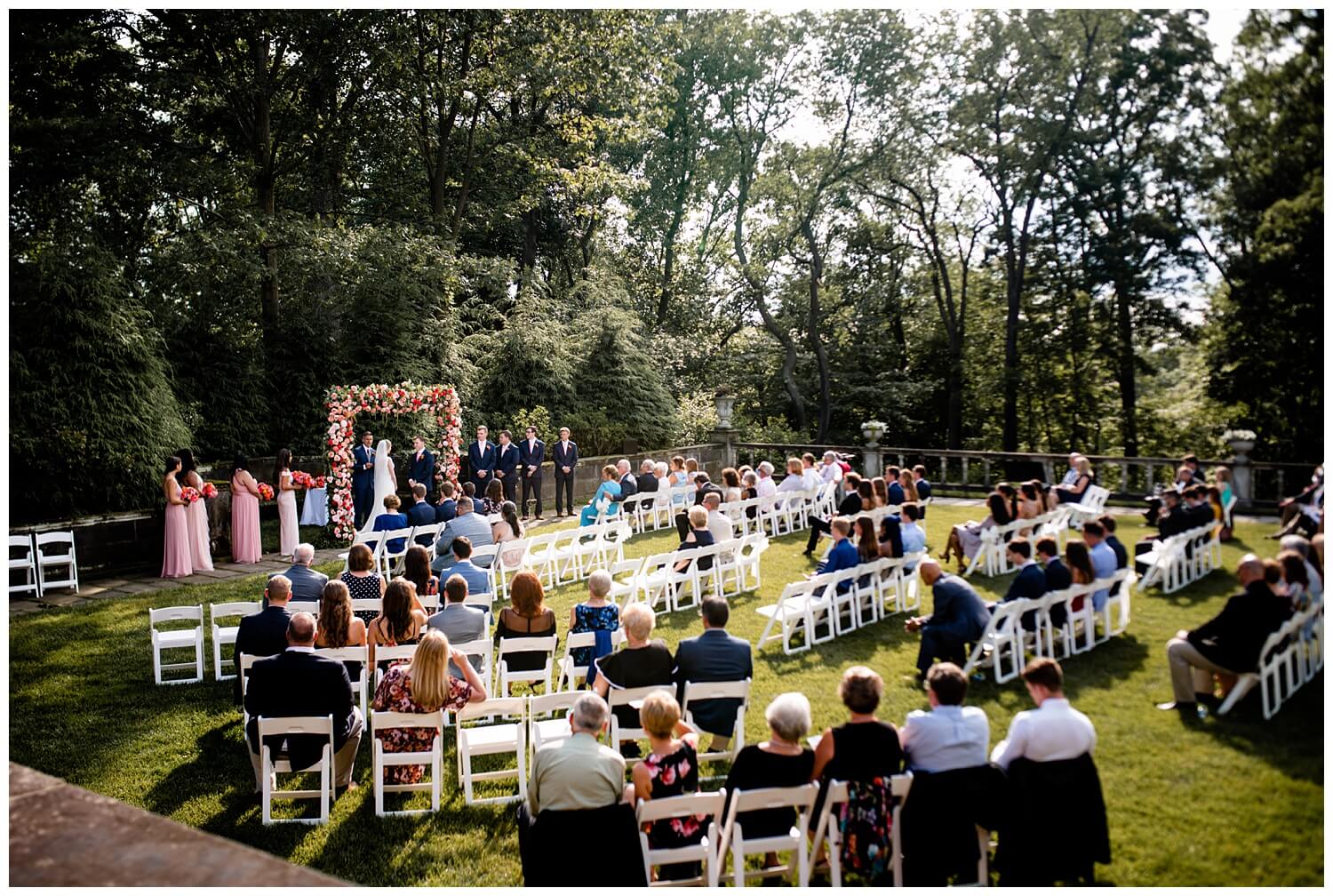 stan hewyt wedding ceremony outside with bride and groom and all their guests