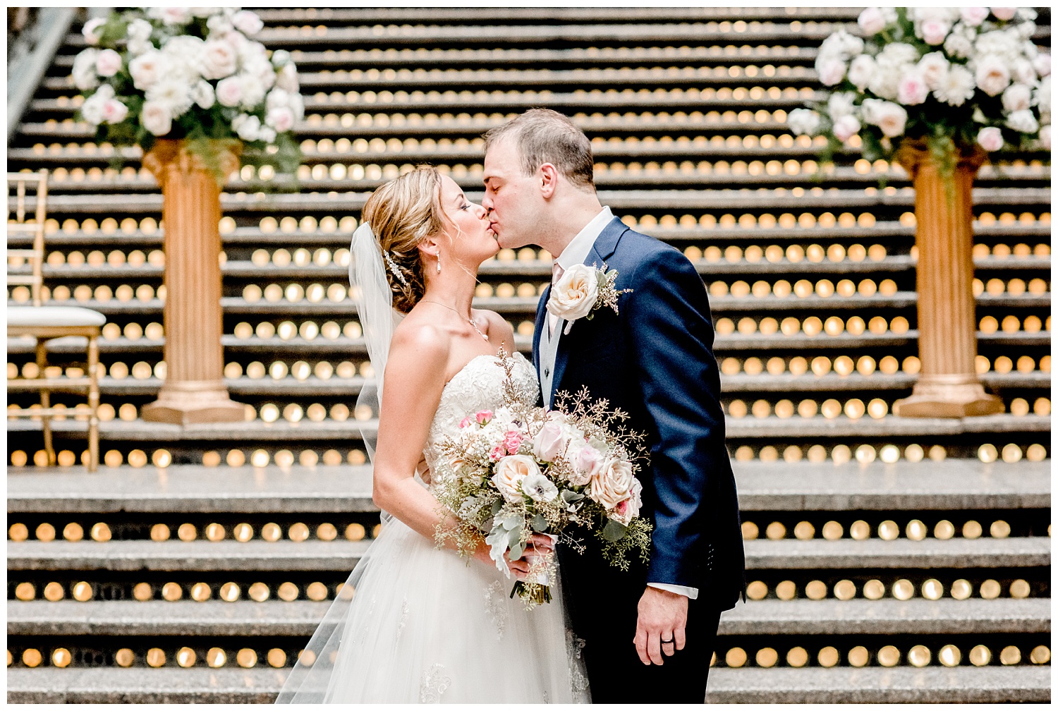 bride and groom kissing on steps at aHyatt Regency Cleveland wedding