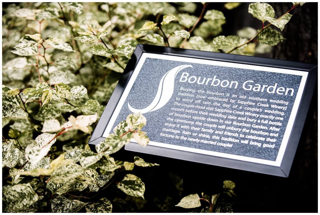 sign at sapphire creek winery for bourbon garden explaining the wedding tradition of burying the bourbon