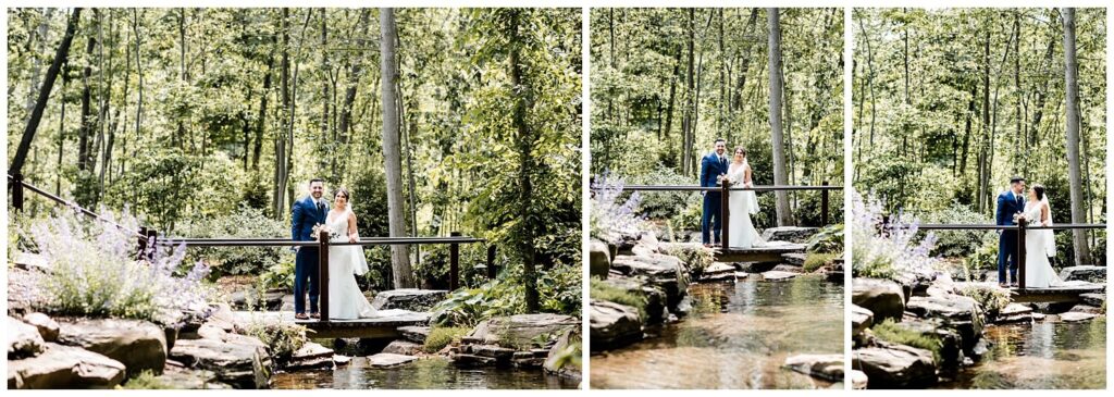 bride and groom standing on bridge at sapphire creek winery and gardens on wedding day