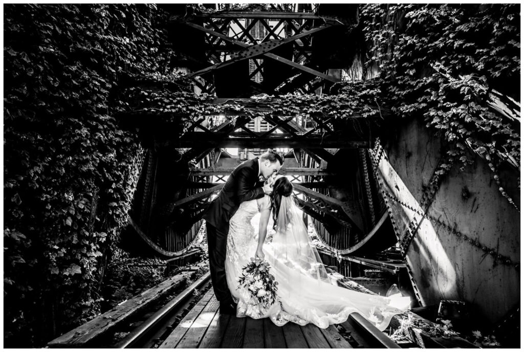 black and white photo of bride and groom at shooters bridge in northeast ohio