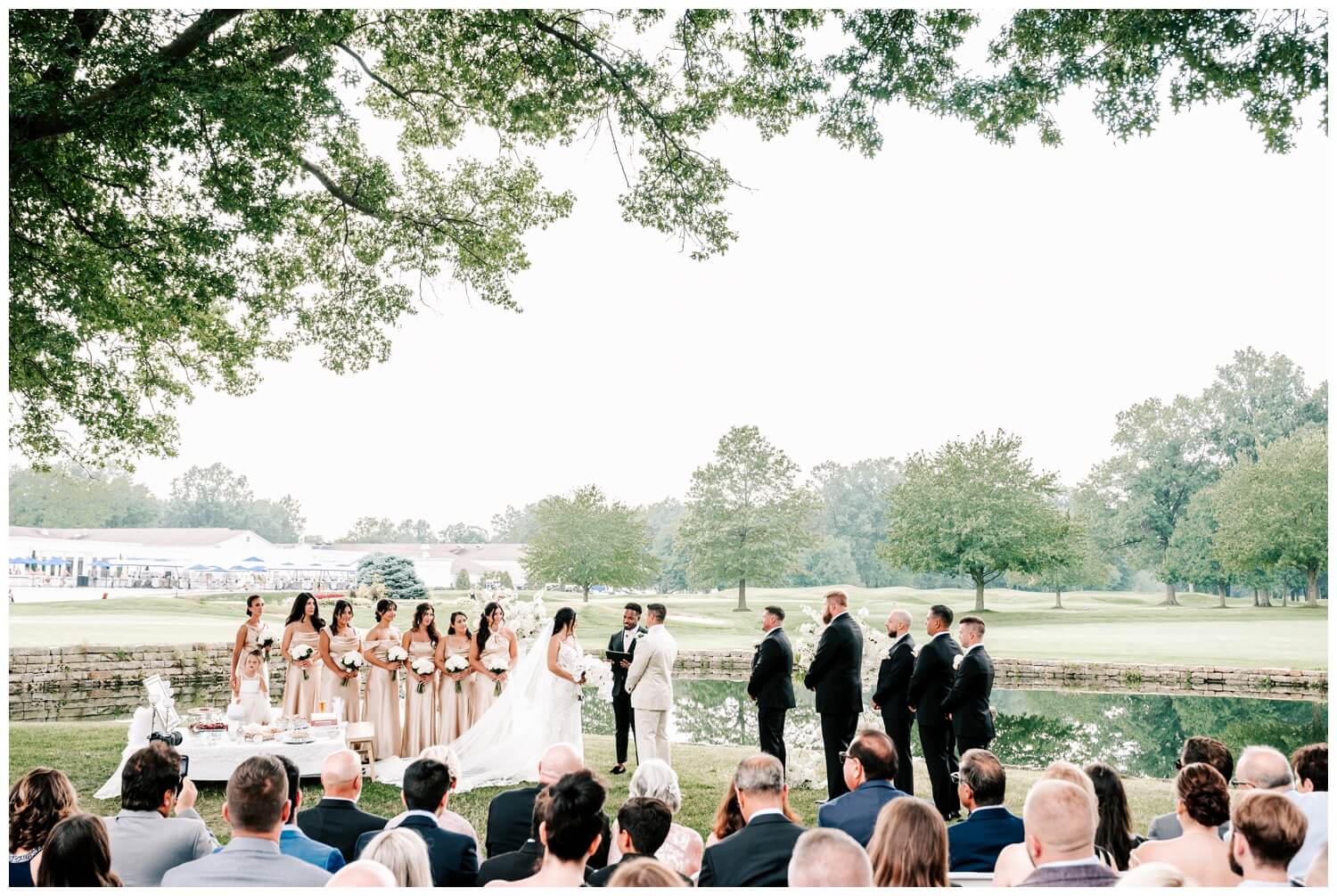 outdoor summer ceremony at avalon country club wedding captured by three and eight photography