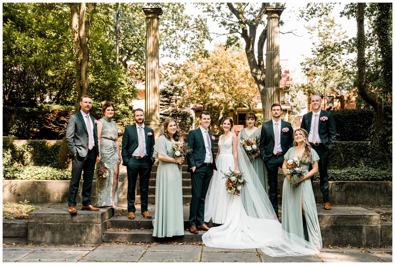 bridal party posing on elliot wedding day in downtown cleveland ohio