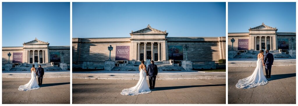 bride and groom posing with cleveland art museum in background