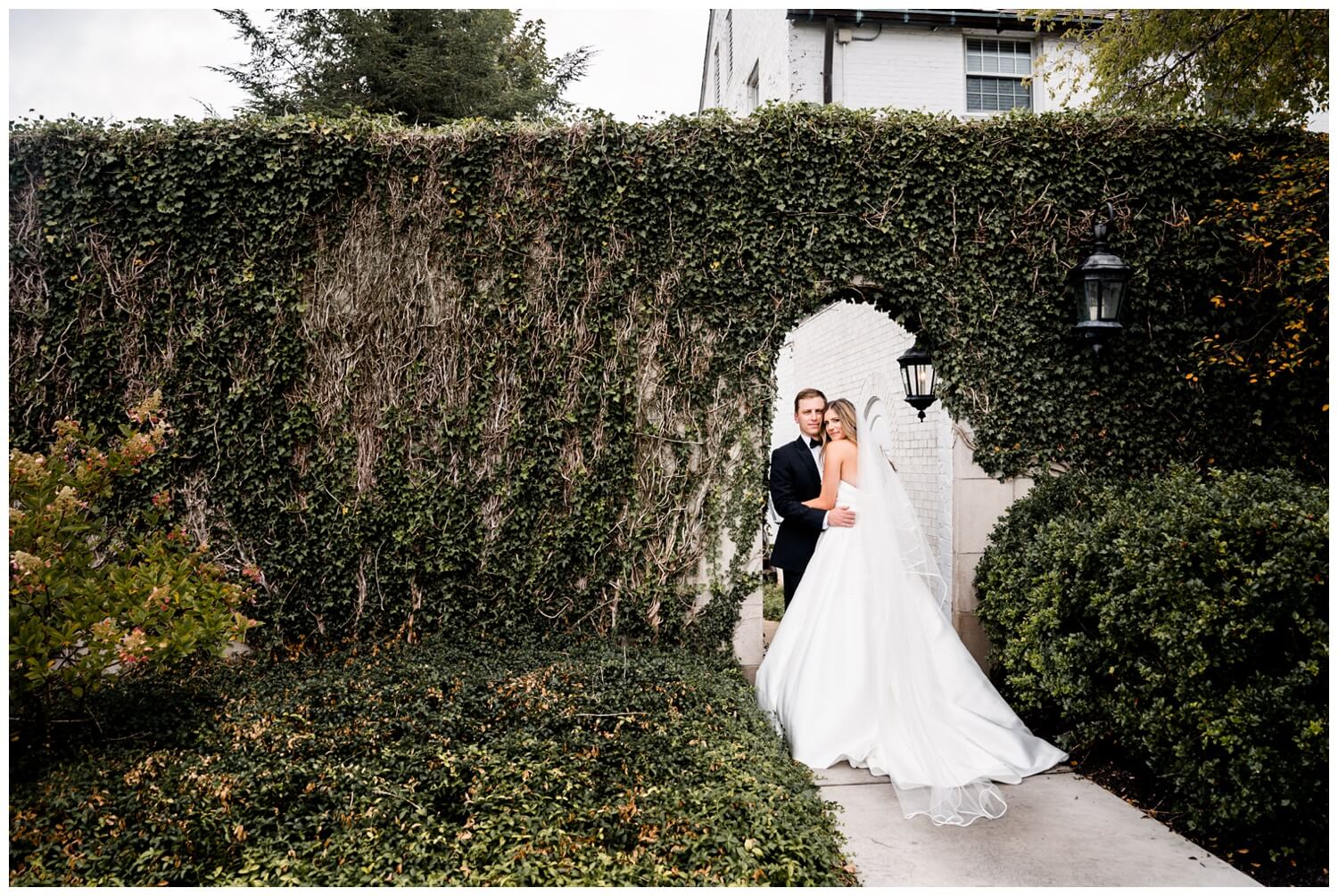 bride and groom hugging in garden at the country club ohio in pepper pike