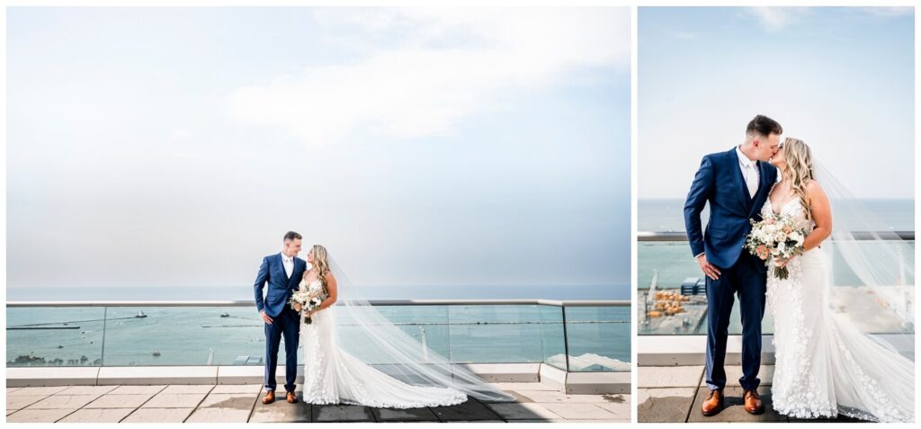 bride and groom looking at each other and kissing on rooftop on downtown cleveland wedding day