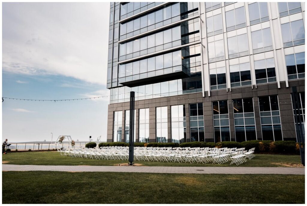 outdoor wedding ceremony set up by lago custom events on lawn of aloft hotel