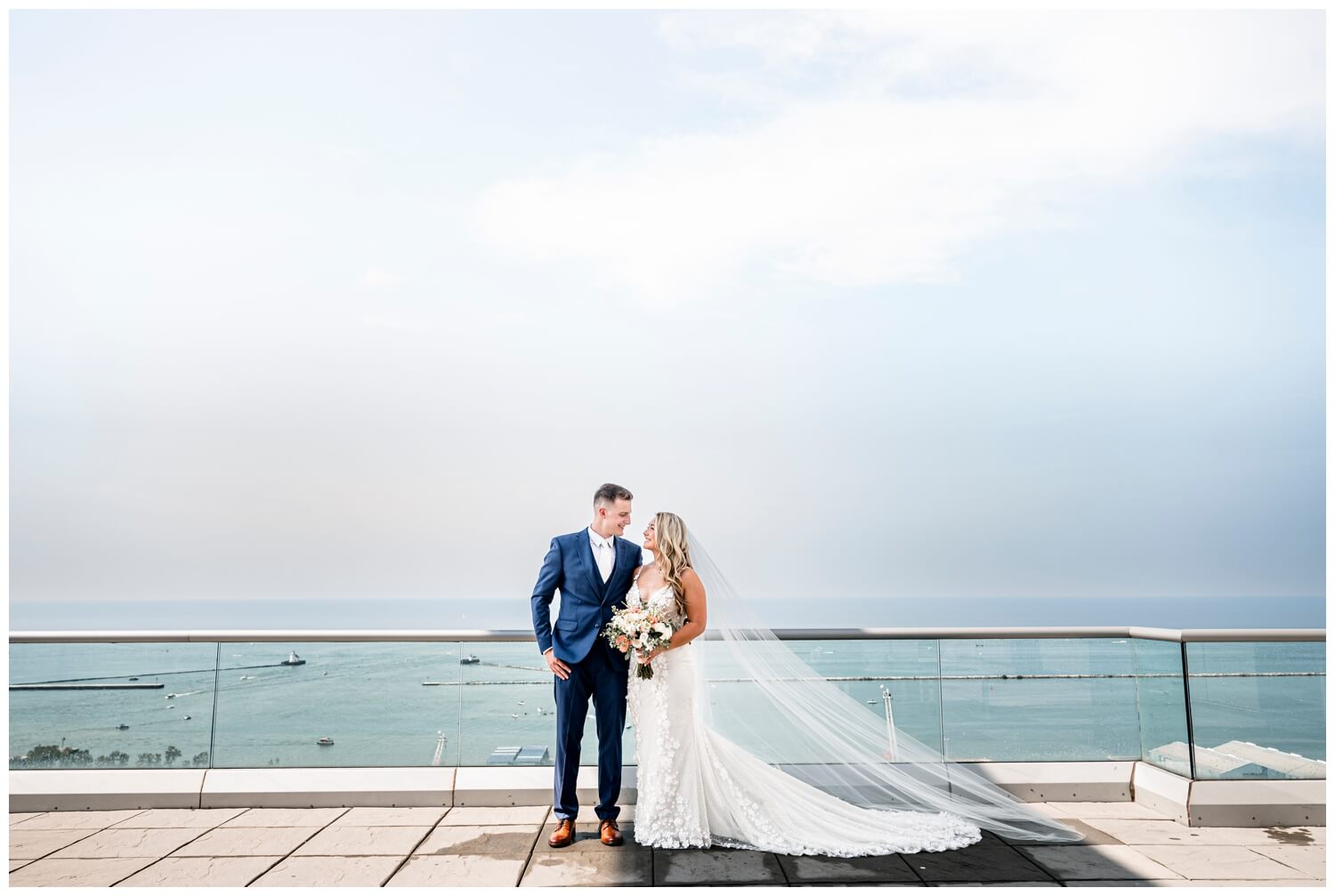 bride and groom posing on rooftop at aloft downtown cleveland wedding