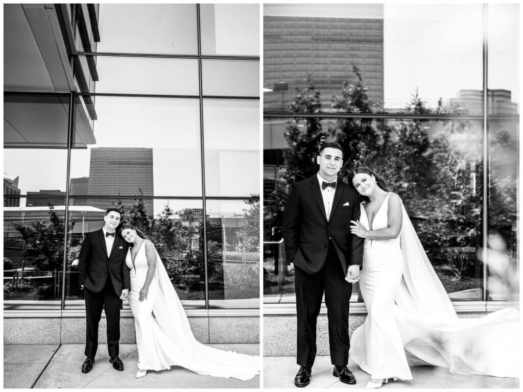 black and white photo of bride and groom smiling together in downtown cleveland at hilton hotel