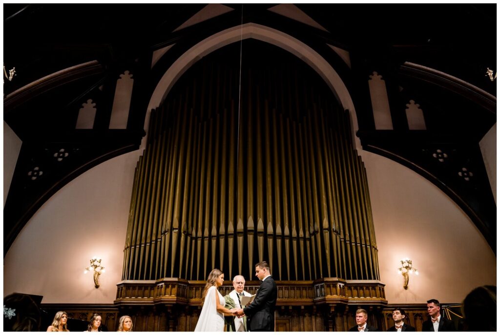 bride and groom looking down while getting married at cleveland wedding chapel