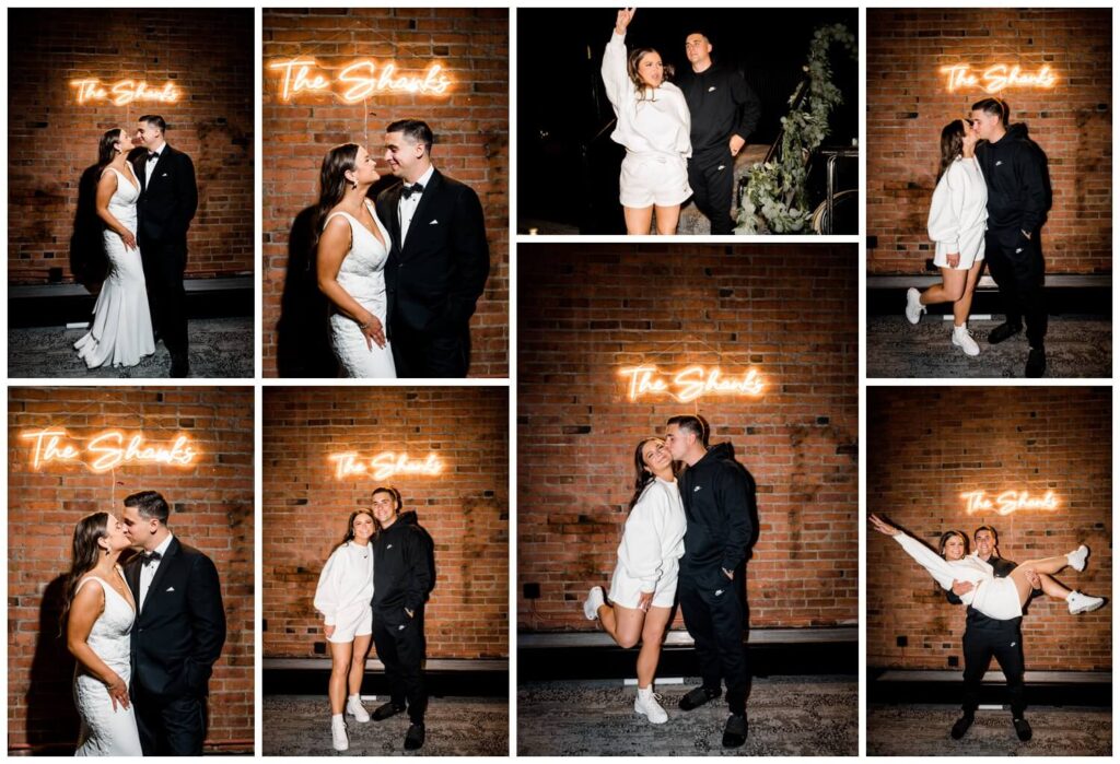 bride and groom posing in front of custom neon sign at windows on the river wedding reception