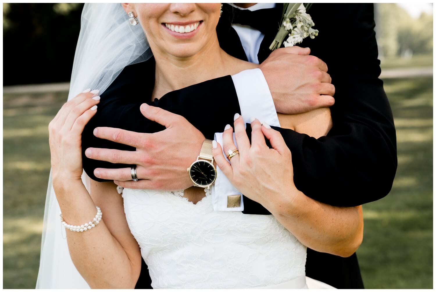 groom standing hugging bride from behind at chagrin valley country club wedding