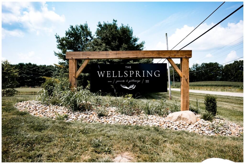 the sign for the wellspring wedding venue in wooster ohio